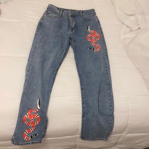 Adika denim jeans with snakes